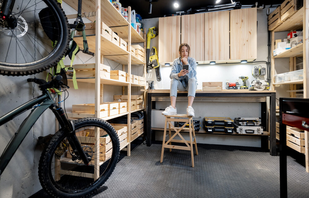 Well,Equipped,Home,Workshop,With,Bicycles,,Wooden,Shelves,And,Woman